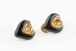 A PAIR OF CITRINE AND ONYX EAR CLIPS, each heart-shaped panel centred with a mixed-cut citrine