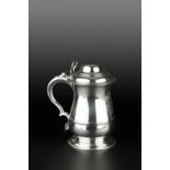 A GEORGE II SILVER TANKARD, of girdled baluster form, having hinged domed cover, and scroll handle