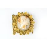 A 19TH CENTURY SHELL CAMEO CLASP, the oval shell cameo carved to depict a classical female
