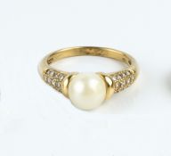A CULTURED PEARL AND DIAMOND DRESS RING BY MAPPIN & WEBB, the cultured pearl measuring approximately