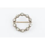 A DIAMOND CIRCLET BROOCH, designed as a row of cushion-shaped old-cut diamonds in pinched collet