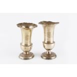 A PAIR OF EDWARDIAN SILVER BALUSTER VASES, with flared and shaped rims, on weighted circular