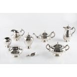 A DUTCH SILVER SEVEN PIECE TEA SERVICE, of shaped outline, comprising teapot and cover, hot milk jug