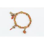 A 19TH CENTURY CORAL FANCY-LINK BRACELET, designed as a line of carved coral corallium rubrum