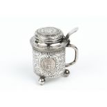 AN EARLY 20TH CENTURY SWEDISH SILVER MINIATURE TANKARD, the hinged lid inset with a coin, engraved