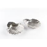 A PAIR OF GEORGE III SILVER BUTTER SHELLS, each on three shell feet, by William Plummer, London