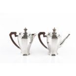 A SILVER BACHELOR'S COFFEE POT & MATCHING HOT MILK POT, of octagonal faceted form, with composite