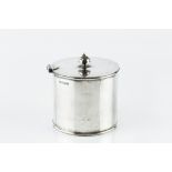 A LATE VICTORIAN SILVER CYLINDRICAL LARGE CONDIMENT JAR, with hinged cover, and blue glass liner, by