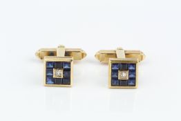 A PAIR OF SAPPHIRE AND DIAMOND SET CUFFLINKS, each square panel centred with a princess-cut diamond,