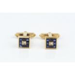 A PAIR OF SAPPHIRE AND DIAMOND SET CUFFLINKS, each square panel centred with a princess-cut diamond,