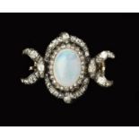 A LATE 19TH CENTURY OPAL AND DIAMOND BROOCH/CLASP, centred with an oval cabochon opal and rose-cut