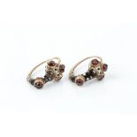 A PAIR OF ENAMEL AND STONE SET BLACKAMOOR EARRINGS, each heightened with black and white enamel,