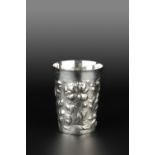 A GERMAN SILVER LARGE BEAKER, of tapered form with slightly flared rim, embossed with flowers and