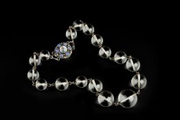 A ROCK CRYSTAL BEAD NECKLACE, the single strand of graduated rock crystal beads to a circular