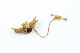 A 19TH CENTURY ENAMEL AND GEM SET BIRD BROOCH, modelled as a robin, with engraved outstretched