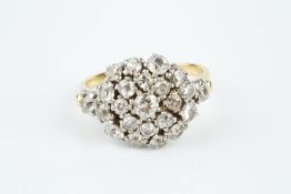 A DIAMOND CLUSTER RING, the circular target cluster of graduated old and single-cut diamonds in claw