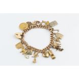 A CHARM BRACELET, the hollow curb-link bracelet stamped '15', with 15ct gold padlock clasp