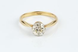 A DIAMOND SINGLE STONE RING, the cushion-shaped old-cut diamond in eight claw setting, two colour