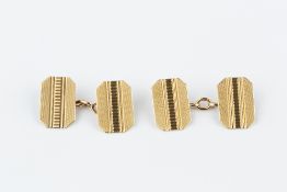 A PAIR OF 9CT GOLD CUFFLINKS, each with octagonal engine-turned panels and chain-link fittings,