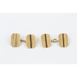 A PAIR OF 9CT GOLD CUFFLINKS, each with octagonal engine-turned panels and chain-link fittings,