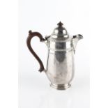 A SILVER HOT MILK POT, with gadrooned border and composite scroll handle by Jay, Richard