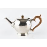 A SILVER TEAPOT, of globular form, with composite handle and knop, by Blackmore & Fletcher Ltd,