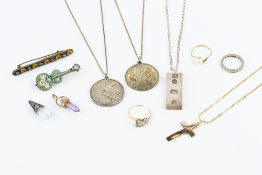 A COLLECTION OF JEWELLERY, comprising a cross pendant, stamped '15ct', on a fancy flattened-link
