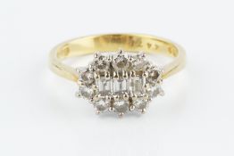 A DIAMOND CLUSTER RING, centred with a trio of rectangular step-cut diamonds, bordered by round