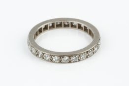 A DIAMOND FULL HOOP ETERNITY RING, set throughout with old and Swiss-cut diamonds, white precious