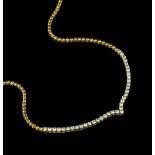 A DIAMOND LINE NECKLACE, designed as a wishbone-shaped line of uniform round brilliant-cut