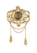 A VICTORIAN CITRINE PANEL BROOCH, the oval mixed-cut citrine in pinched collet setting, to a