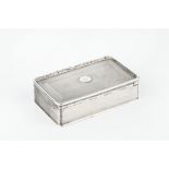 A GEORGE IV SILVER RECTANGULAR SNUFF BOX, with reeded and engraved decoration, and foliate