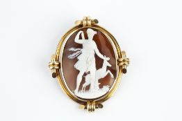A LATE VICTORIAN SHELL CAMEO BROOCH, the oval shell cameo carved to depict Artemis, the Greek