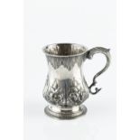 A MID VICTORIAN SILVER BALUSTER CHRISTENING MUG, embossed with flowers and foliage, and with