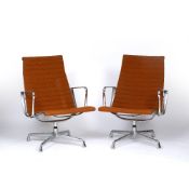 Charles Eames (1907-1978) for Vitra A pair of EA 108 swivel chairs aluminium base and orange