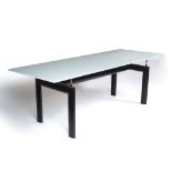 After Le Corbusier (1887-1965) Tube d'Avion LC6 dining table, designed in 1926 frosted glass top