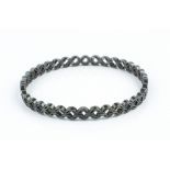 Jack Spencer Oxidised silver bangle abstract twist design with shield-shaped maker's mark hallmarked