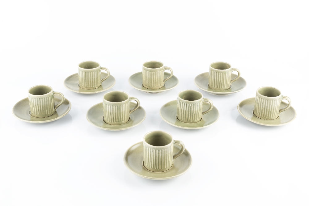 David Leach (1911-2005) A set of eight coffee cups and saucers celadon glaze impressed potter's