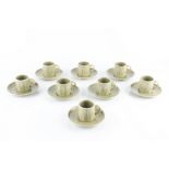 David Leach (1911-2005) A set of eight coffee cups and saucers celadon glaze impressed potter's