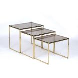 Italian School Nest of tables, circa 1950 brass frames with glass tops 46cm high, 54cm wide.