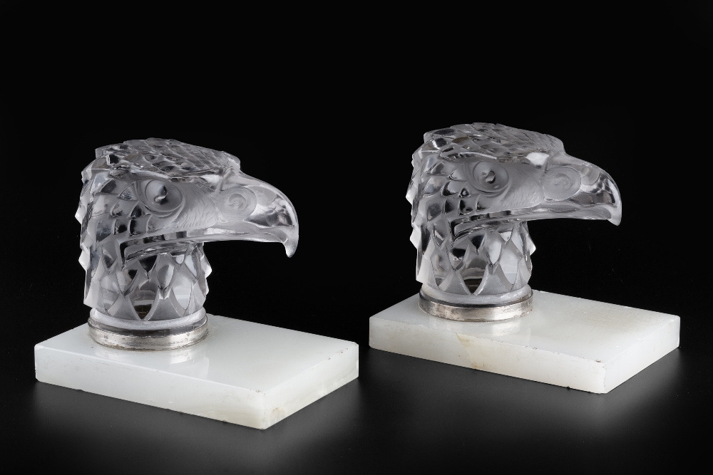 René Lalique (1860-1945) A pair of Tete D'Aigle car mascots, circa 1930 frosted glass on hardstone