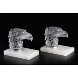 René Lalique (1860-1945) A pair of Tete D'Aigle car mascots, circa 1930 frosted glass on hardstone