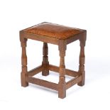 Robert Thompson of Kilburn (1876-1955) Mouseman stool, circa 1960s oak, with carved octagonal legs