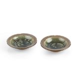 Walter Keeler (b.1942) A pair of shallow bowls salt-glazed with dark green glaze to centre impressed