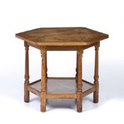 Robert Lorimer (1864-1929) Occasional table the octagonal top over six turned legs and lower tier