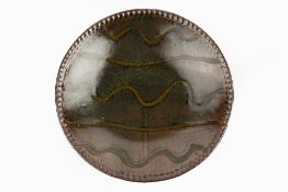 Edward Hughes (1953-2005) Charger tenmoku, pressed edges, wave decoration impressed potter's seal