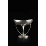 David Aitken An Arts & Crafts tazza, 1907 silver, the hammered bowl raised on four looped supports
