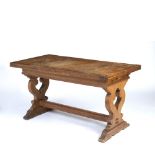 Robert Lorimer (1864-1929) Refectory table oak, the rectangular top over shaped supports joined by