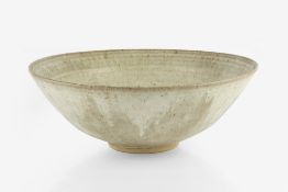 Emmanuel Cooper (1938-2012) Large bowl, circa 1970 light running glaze over oatmeal ground impressed