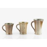 Walter Keeler (b.1942) Three jugs salt-glazed with brown glaze to exterior and green glaze to
